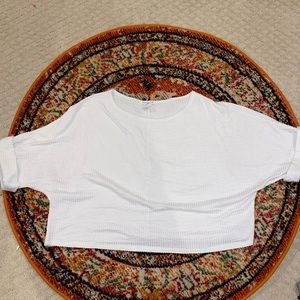 Cropped sweater with medium length sleeves